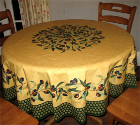 beige 71" round coated protective cloth with olive design
