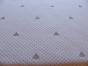 Pique fabric with embroidered bees beige colour