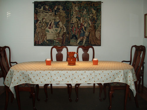very long rectangular tablecloth on a rectoval table