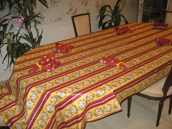 Very long coated rectangular French tablecloth red ochre