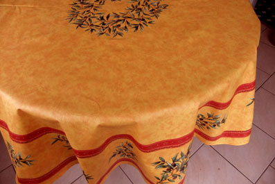 yellow coated round cloth with olives
