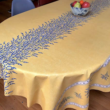 yellow coated tablecloth with lavender designs