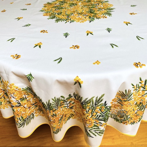 70in round large oilcloth with mimosa design